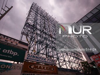 San Fernando, Pampanga, Philippines - A billboard advertisement is folded in San Fernando, Pampanga as the country braces for Typhoon Maysak...