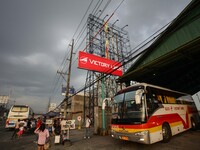 San Fernando, Pampanga, Philippines - A billboard advertisement is folded besides a provincial bus station in San Fernando, Pampanga as the...