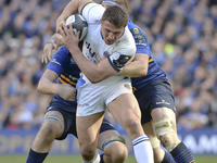 Bath's Tom Homer tackled by Leinster's  Jamie Heaslip and David Toner during European Champions Cup Quarter-Final meeting between Leinster R...