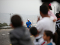 Israeli are running or participating in the marathon during an Israeli marathon in Easter near Al Sawia village in the west bank, on April 9...