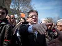 Jean Luc melanchon shaking hands  during a protest as part of a national mobilization against the government's austerity measures and for al...