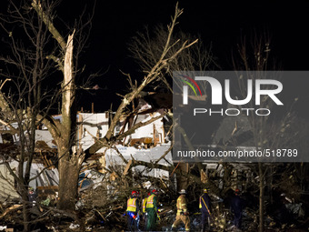 Emergency personal searches in the rubble for survivors after a tornado struck the town of Fairdale, Illinois, United States on April 9, 201...