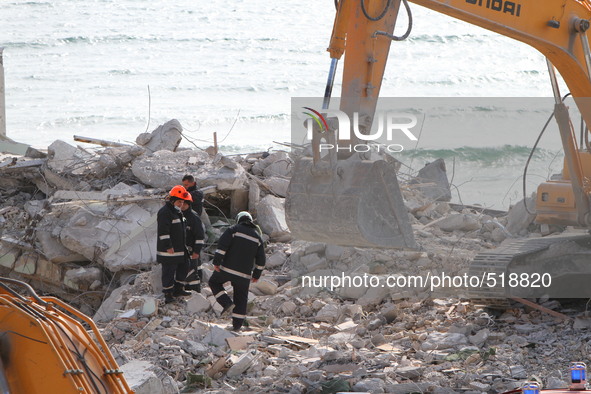 Rescue workers search for survivers under an 11-storey hotel building collapsed at the Black sea resort of St. Konstantin and Helena 450 kms...