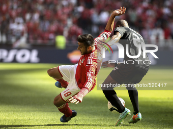 Academica's defender Christopher Oualembo (R) vies with Benfica's forward Eduardo Salvio during the Portuguese League football match between...