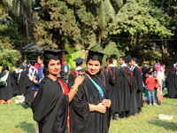A group of graduates expressing their delight in front of the Curzon hall at university area, on the 52th convocation of the students of Dha...
