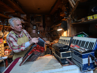 Former theatre actor and long time artist and luthier, Jozef Gmyrek (age 71), repairs an accordion in his workshop.
His work is not a job bu...