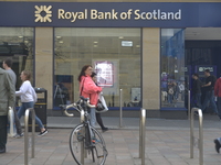 Light shining on a branch of the Royal Bank of Scotland reflecting on Saturday 11th April 2015 in Glasgow. (