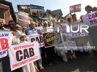 Muslim activists hold placards during a protest against the Citizenship Amendment Bill (CAB) in Mumbai, India on 13 December 2019. The bill...