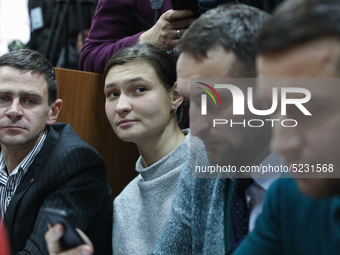 Suspect Yana Duhar sits between her lawyers during a court hearing on her preventive measure in Kyiv, Ukraine, 13 December 2019, during inve...