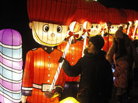 Visitors look on giant installations from lanterns, during the Christmas Festival of Giant Chinese Lanterns 'Legends of China' at the Pecher...