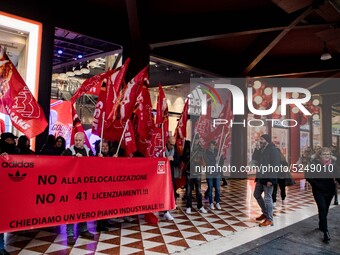 Employees of the well-known clothing brand Adidas protest in front of the Adidas store in Milan against the 41 dismissals due to the relocat...
