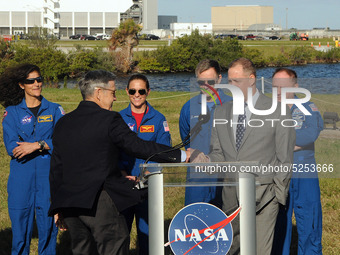 Kennedy Space Center Director Bob Cabana (2nd left) and NASA Administrator Jim Bridenstine shake hands while NASA astronauts (from left) Sun...