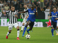 Roberto Pereyra and Geoffrey Kondogbia during the Champions Luague match between Juventus FC and AS Monaco at the Juventus Stafium of Turin...