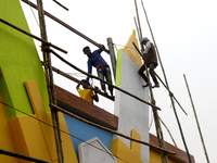 Bangladeshi day labor works at the construction site of Dhaka international Trade Fair in Dhaka, Bangladesh, on December 26, 2019. (