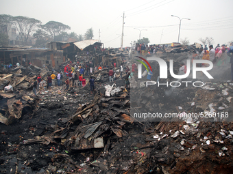 At least 20 shanties and 14 shops are burnt in a fire incident at Hirur Maar Slum in Dhaka’s Kalshi area on early Friday morning, December 2...