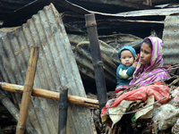 At least 20 shanties and 14 shops are burnt in a fire incident at Hirur Maar Slum in Dhaka’s Kalshi area on early Friday morning, December 2...