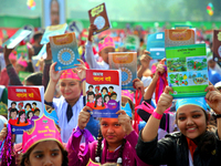 Bangladeshi Students receive free textbooks from government to celebrate on the first day of the New Year in Dhaka on January 1, 2020. The B...
