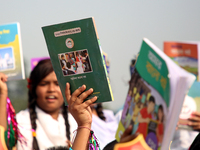 Bangladeshi Students receive free textbooks from government to celebrate on the first day of the New Year in Dhaka on January 1, 2020. The B...