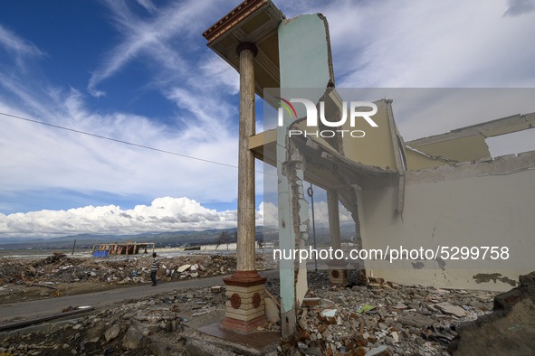 A resident in front of a house damaged by the tsunami in Kampung Lere Beach, Palu Bay, Central Sulawesi, Indonesia on January 9, 2020.  The...
