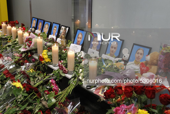Flowers and candles are seen at a makeshift memorial for the crew members of the Ukrainian Boeing 737-800 plane that crashed in Iran, at the...