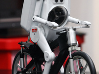 Murata Manufacturing Co Ltd's bicycle-riding robot 