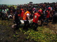 Rescuers have rescued a dead body from Meghna river near Munshigonj, Dhaka, Bangladesh on 16 May 2014. This deadbody is rectified as one of...