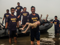 Navy divers have recover the body of a dead child who was killed the MV Miraj-4 passenger vessel capsized on the Meghna River near Munshigon...