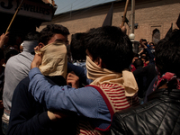 SRINAGAR, INDIAN ADMINISTERED KASHMIR, INDIA - APRIL 17: Kashmiri protesters tie masks on the faces during a protest on April 17, 2015 in Sr...