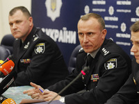 Ukraine's National Police Chief Ihor Klimenko (L) and the Chief of Police of the Kyiv region Andriy Nebytov (C) speak during a press-briefin...