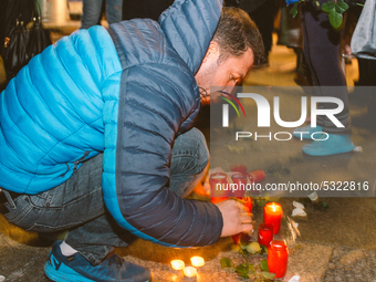 A man lights candle in Cologne, Germany, on 14 January 2020 during the protest  over the shooting down at Tehran of Ukrainian Airliner last...