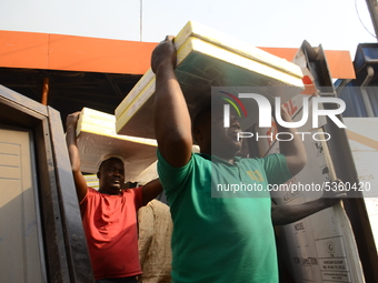 Traders rescuing some remains of their properties at the popular timber market in Mushin, Lagos January 25, 2020. There have been no casualt...
