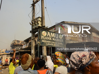 Crowds gather at the popular timber market in Mushin, Lagos January 25, 2020. There have been no casualties reported, and the cause of the f...