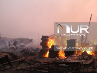 Fire burns Amu Plank Market in Mushin area of Lagos, Nigeria on Saturday Jan 25, 2020. Fire fighters have not been able to put out the fire...