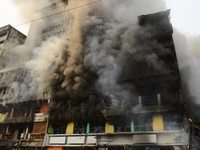 Team of fire fighters extinguishing a fire after a fire broke out in a section of the balogun market in Lagos Island on January 29, 2020.  (