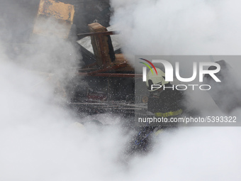 Firefighters along with Army and Police work to put out a fire at warehouse, located in Lalitpur , Kathmandu, on Sunday, February 02, 2020....