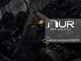 Firefighters along with Army and Police work to put out a fire at warehouse, located in Lalitpur , Kathmandu, on Sunday, February 02, 2020....