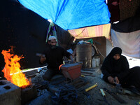 A pregnant woman and her husband Hassanein family on April 22, 2015 in Gaza worked in blacksmithing a difficult profession to women, but pov...