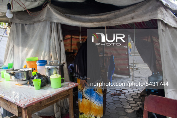 A survivor mother is active in her emergency tent at the Agung Mosque shelter in Palu, Central Sulawesi, Indonesia on February 13, 2020. Hun...