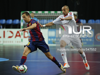 Barcelona's forward Lin  (L) vies for the ball with Barcelona's forward Dyego (R)  during the UEFA Futsal Cup, final match between Kairat Al...