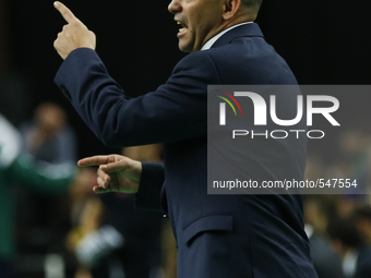 Kairat's coach Cacau issues instructions  during the UEFA Futsal Cup, final match between Kairat Almaty and FC Barcelona at the Meo Arena in...