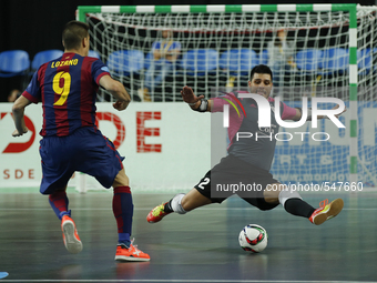 Barcelona's forward Sergio Lozano (L) vies for the ball with Kairat's goalkeeper Higuita (R)  during the UEFA Futsal Cup, final match betwee...