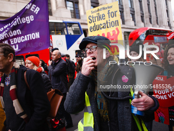 Members and supporters of the striking University and College Union (UCU) hold a 'March For Education' in London, England, on February 26, 2...