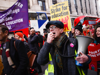 Members and supporters of the striking University and College Union (UCU) hold a 'March For Education' in London, England, on February 26, 2...