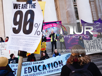 Members and supporters of the striking University and College Union (UCU) rally outside the Royal Exchange at Bank Junction following its 'M...