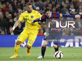 BARCELONA, SPAIN - APRIL 28: Lep Messi and Lacen during the match of the week 34 of the spanish league, between FC Barcelona and Getafe CF,...