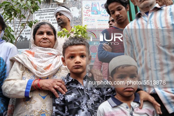 Family members of Bhure Ali pose for picture during his funeral in Mustafabad area of east Delhi, India on 04 March 2020. Ali, a labourer le...