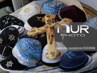 A cross and Jewish traditional kippahs for sale in Jerusalem's Old City.
With the total to 42 Israelis tested positive for coronavirus, Isra...
