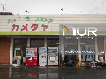 An abandoned grocery store with beverage and cigarette vending machines in Futaba, Fukushima prefecture at 10 March 2020.
 (