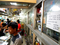 A sign advertising hand sanitizer and face masks is displayed at a pharmacy amid fears of the spread the coronavirus in Dhaka, Bangladesh, o...