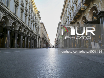 A view of Via Roma, in the center of Turin, on March 10, 2020, deserted after Italy imposed unprecedented national restrictions on Tuesday t...